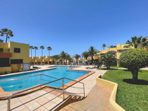 Seaside Apartment Corralejo : A cozy holiday home in a peaceful well located green complex